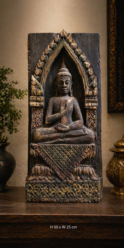 Antique Thai wooden Buddha temple panel displayed in an interior
