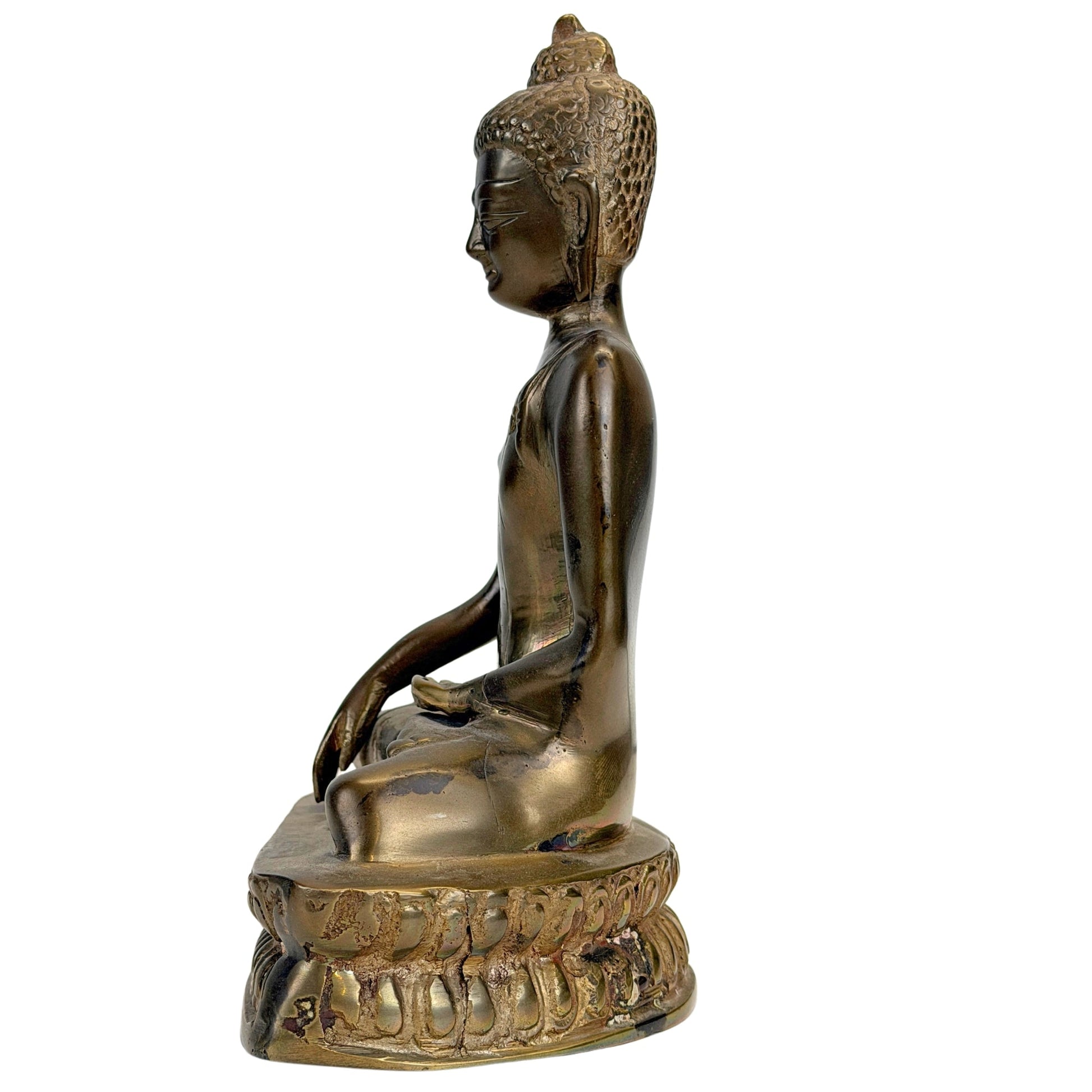 Side view of the antique 19th-century Tibetan bronze Buddha