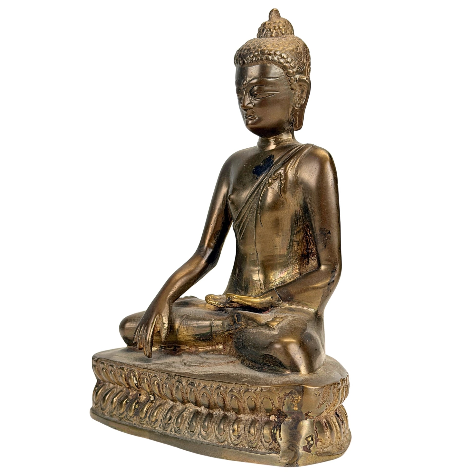 Front three-quarter view of the antique Tibetan Buddha with layered patina