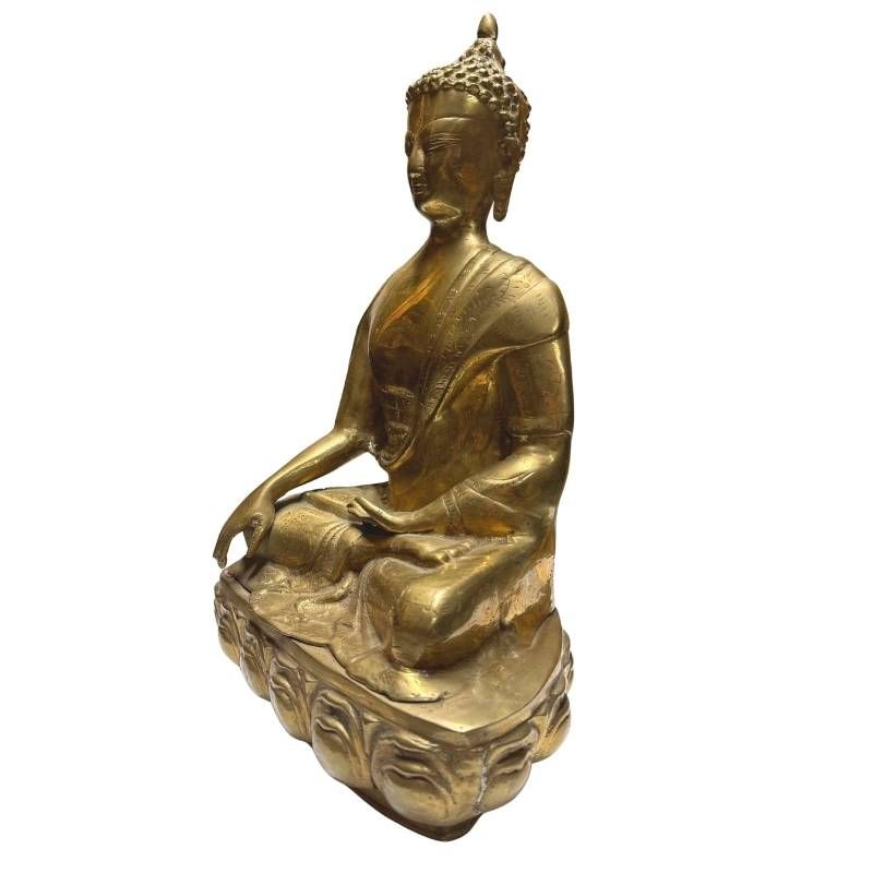 Antique Tibetan gilt bronze Buddha, front-right view in seated posture