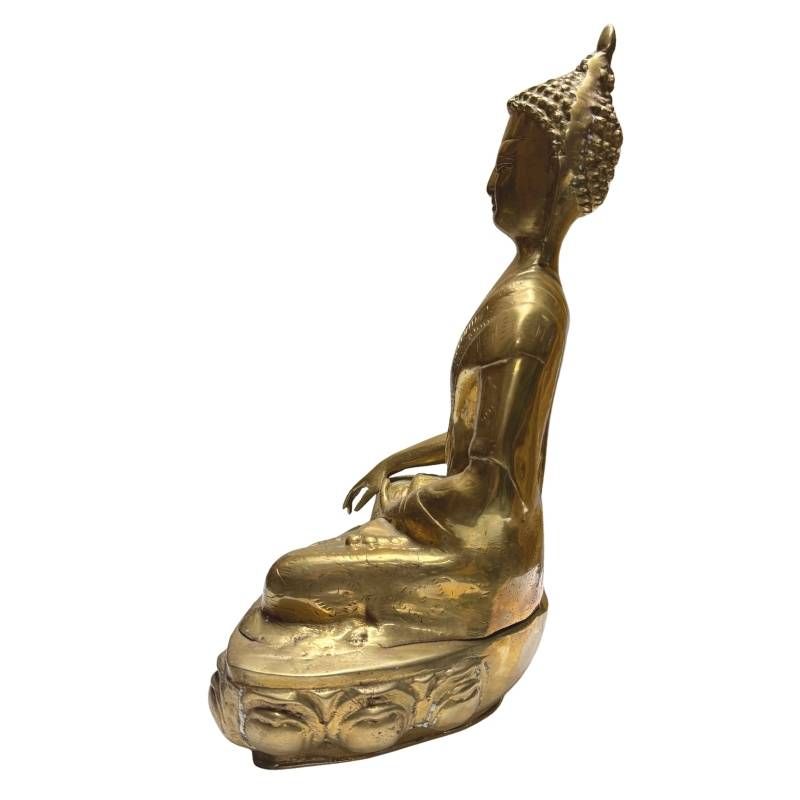Antique Tibetan gilt bronze Buddha, right profile on lotus base