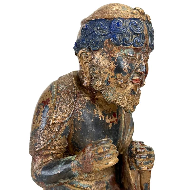 Arhat figuur op buffel in brons uit Himalaya traditie