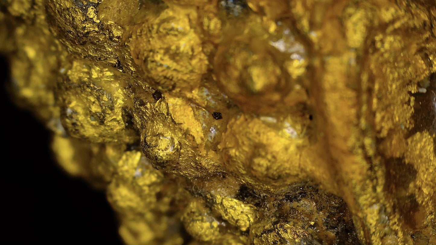 Macro detail of historic gilding, lacquer and patina on the Ayutthaya Buddha, view 01