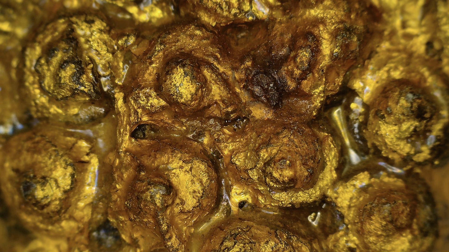 Macro view of gilding remnants and aged patina on the antique Ayutthaya Buddha, detail 03