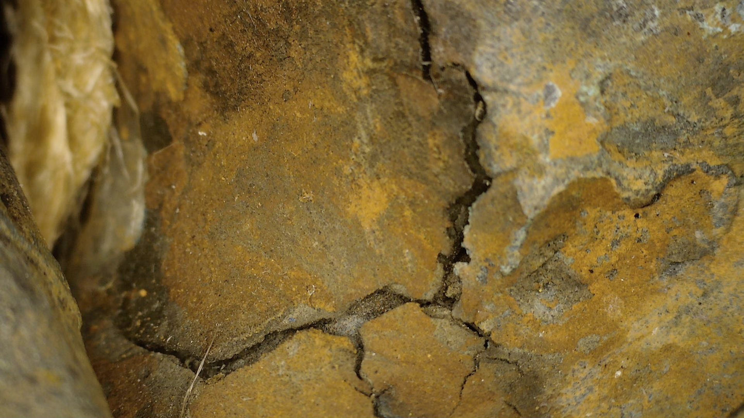 Macro examination of the aged bronze surface and historic gilding on the Ayutthaya Buddha, view 07