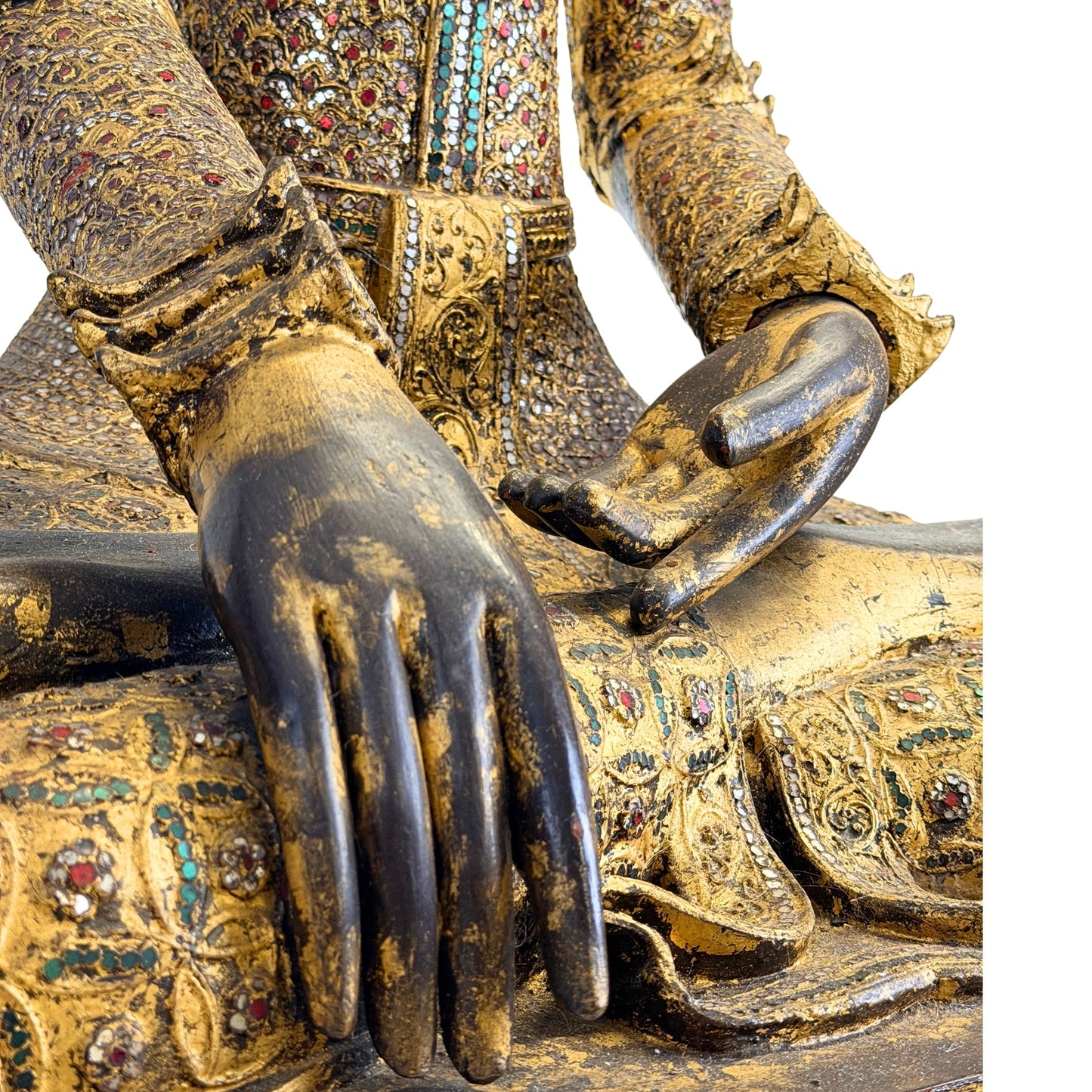 Historic gold-leaf surface on the antique Burmese Buddha