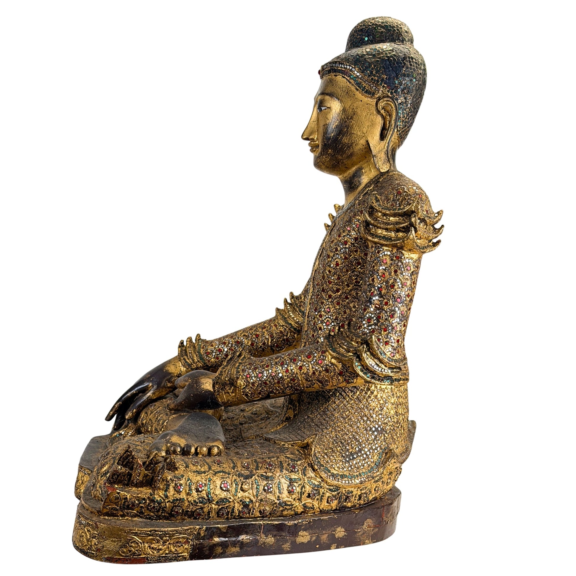 Carved teak and decorative surface detail on the Burmese Mandalay Buddha