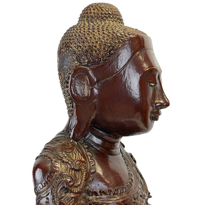 Left facial profile of the antique Burmese Mandalay Buddha with surviving gilding