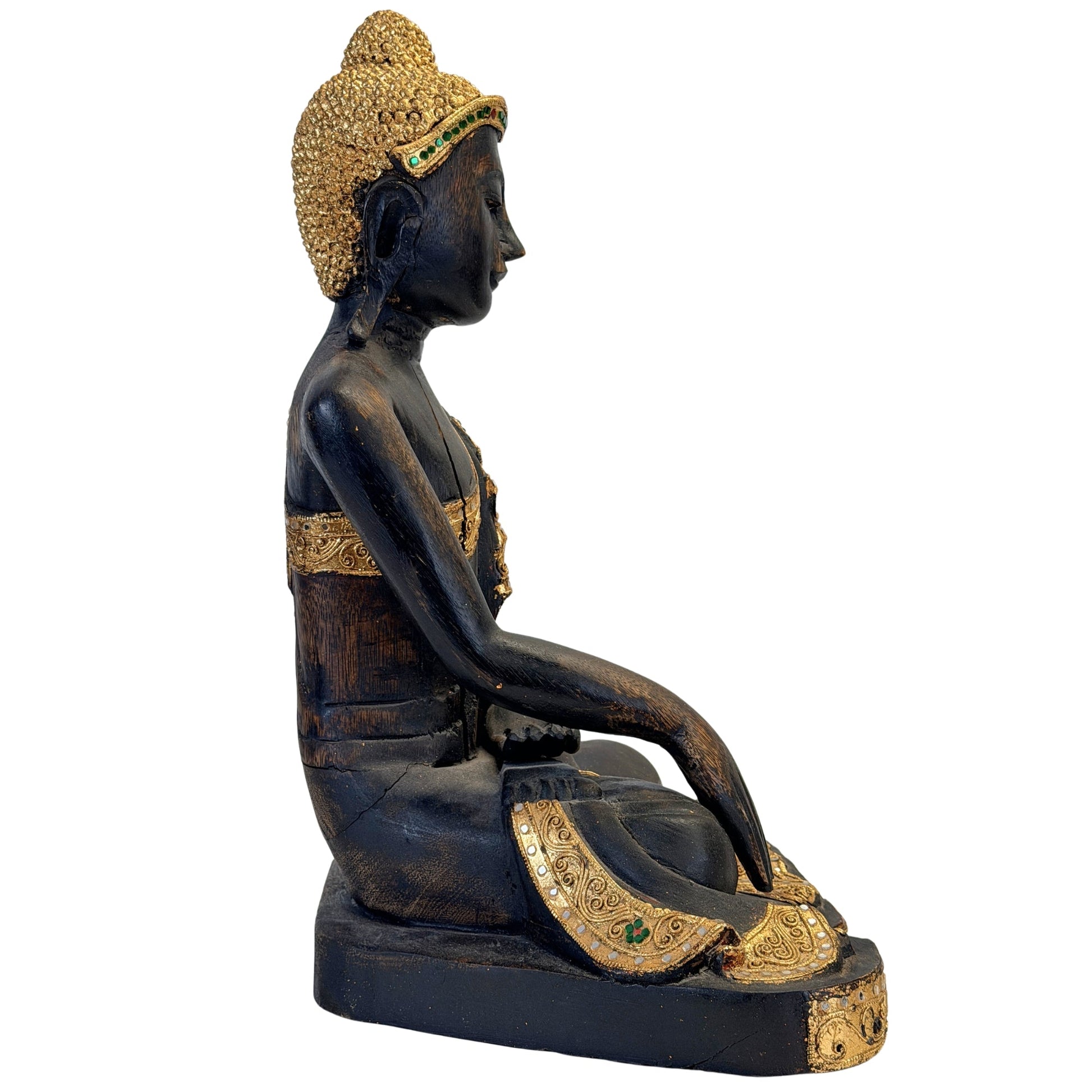 Gilded hair curls and green glass inlay on the Burmese Mandalay Buddha