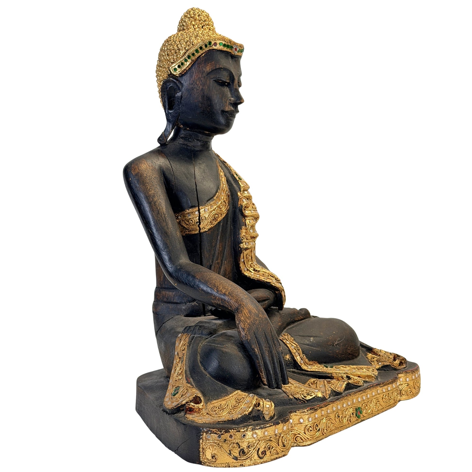 Right-side view of the antique Burmese Buddha with gilded robe and glass inlay