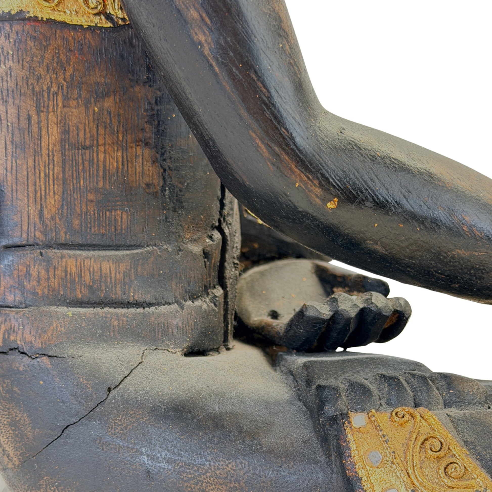Condition detail showing historic shrinkage cracks and wear in the carved wood
