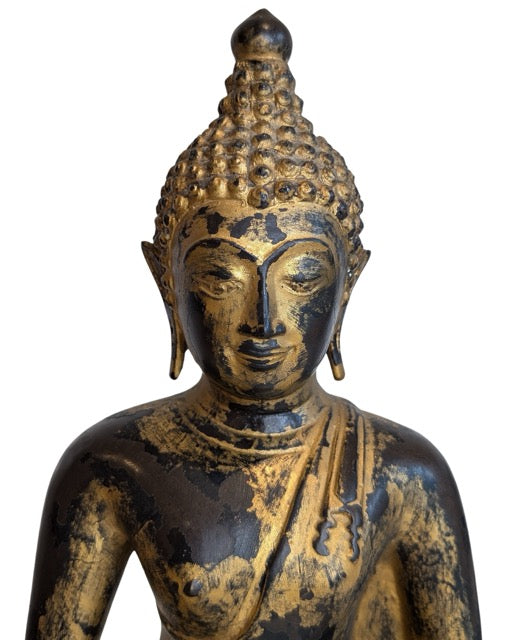 Aged patina and gilding remnants on the Burmese Buddha