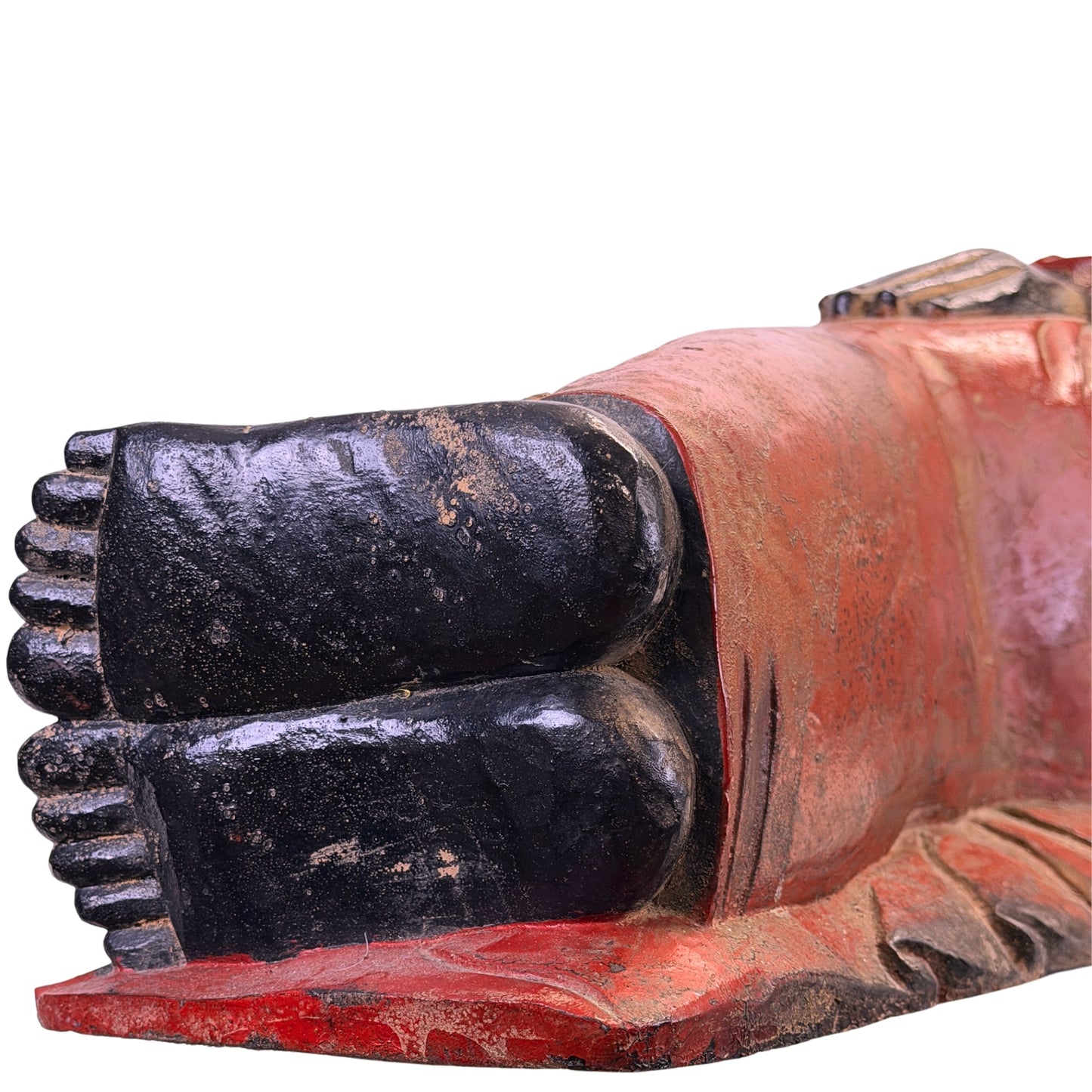 Black lacquered soles showing age-related wear on the Burmese reclining Buddha