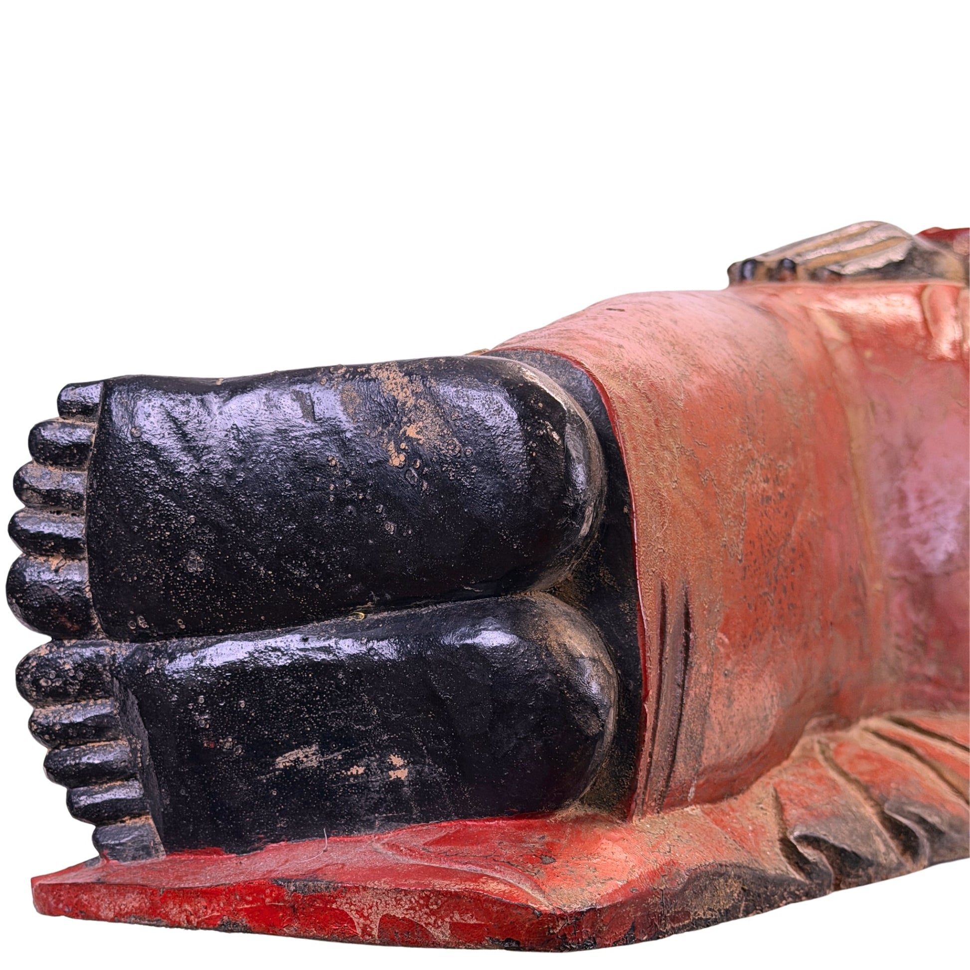 Black lacquered soles showing age-related wear on the Burmese reclining Buddha
