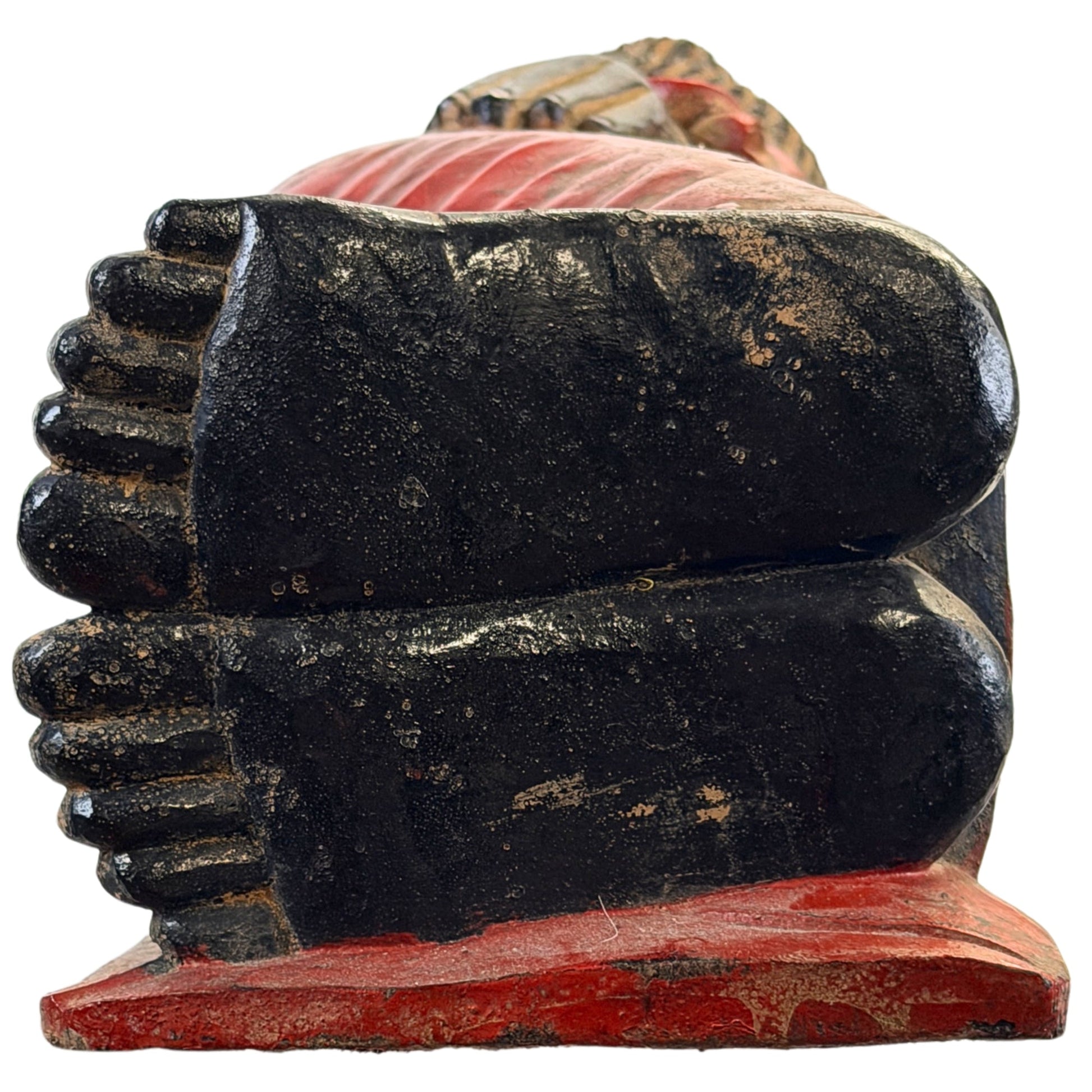 Frontal view of the feet of the antique Burmese reclining Buddha