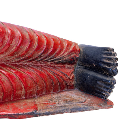 Feet and red polychrome robe of the antique Burmese reclining Buddha