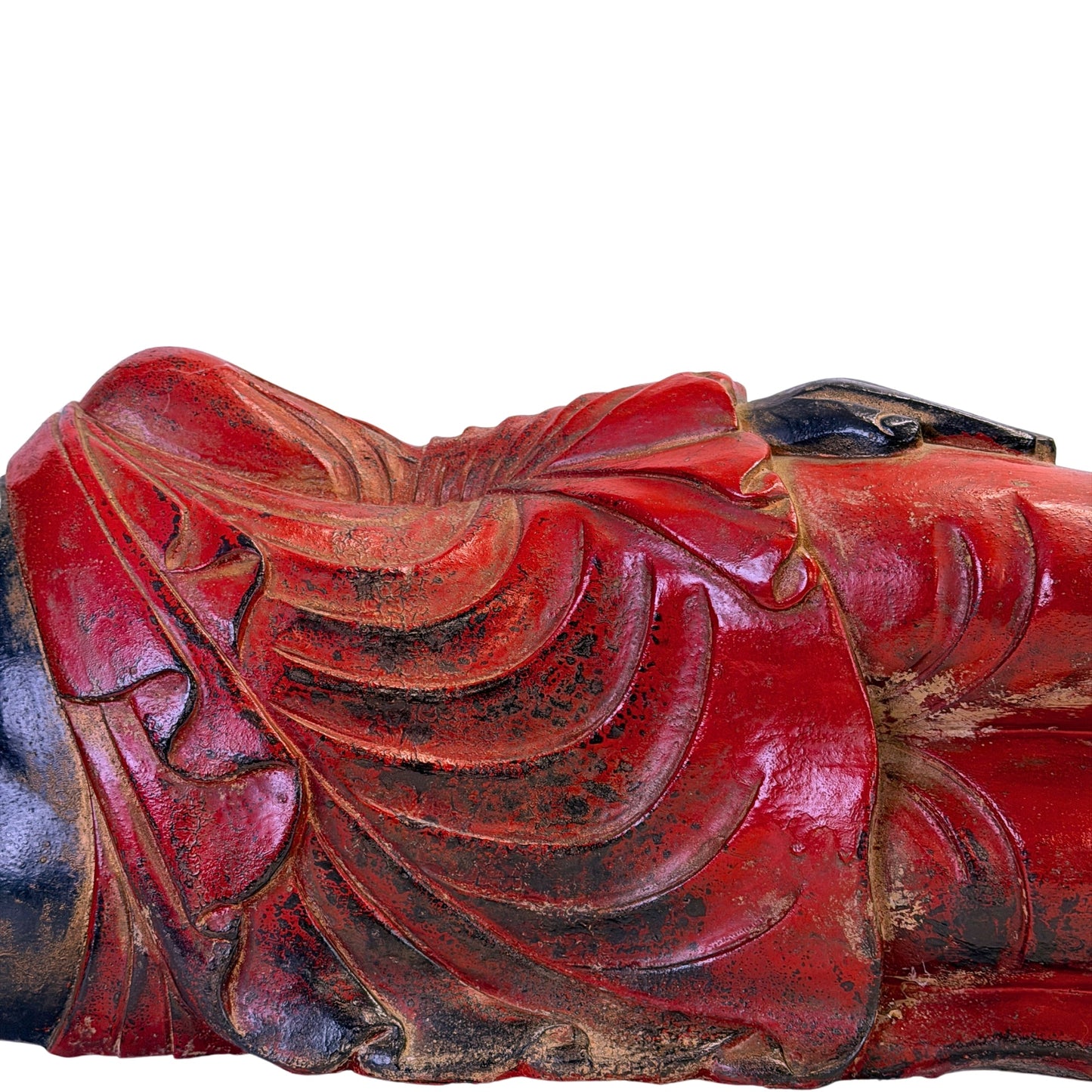 Red polychrome robe folds with traces of historic gilding on the Burmese reclining Buddha