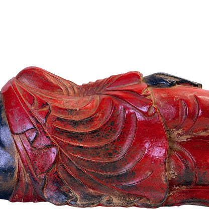 Red polychrome robe folds with traces of historic gilding on the Burmese reclining Buddha