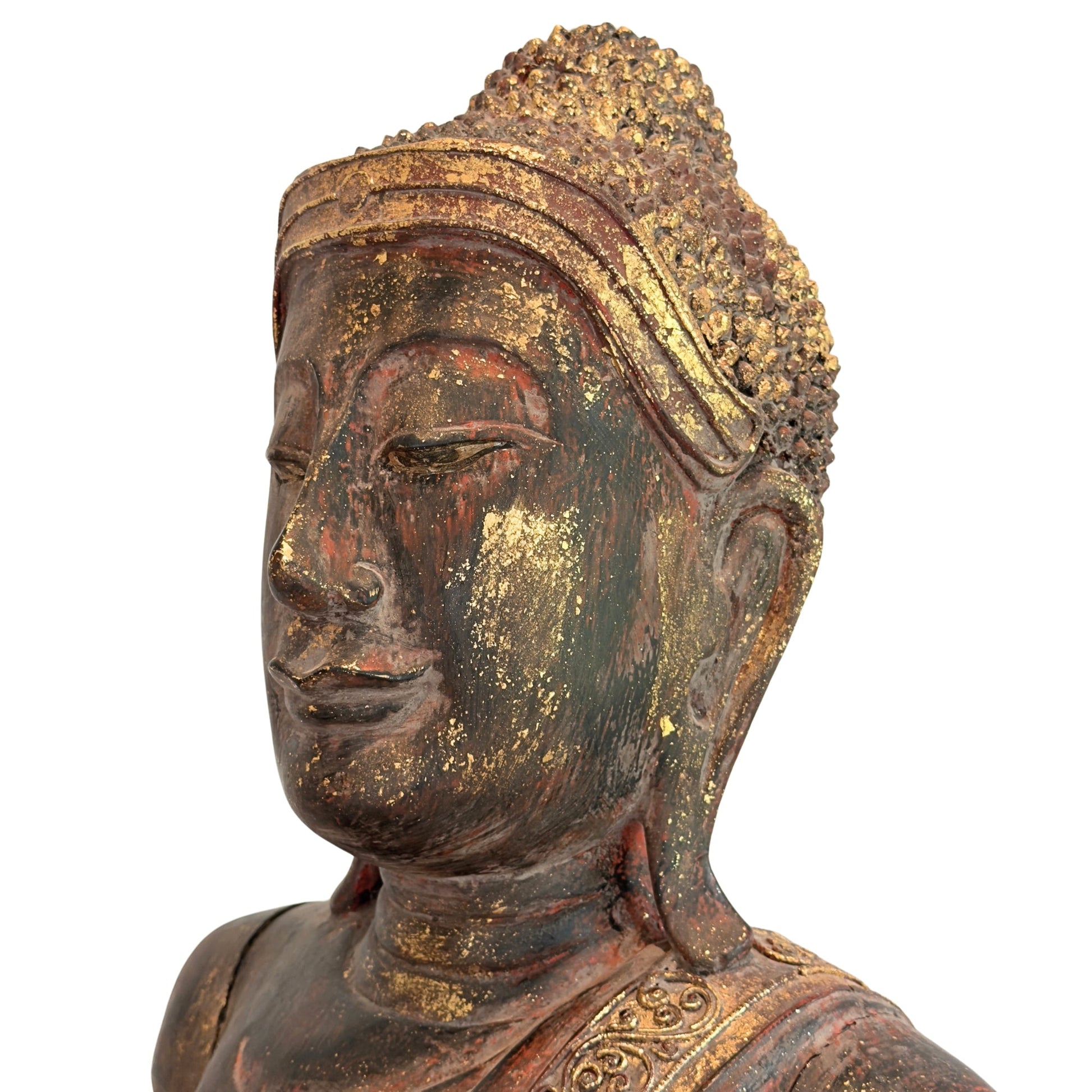 Close facial view showing aged lacquer and gilding on the Burmese standing Buddha