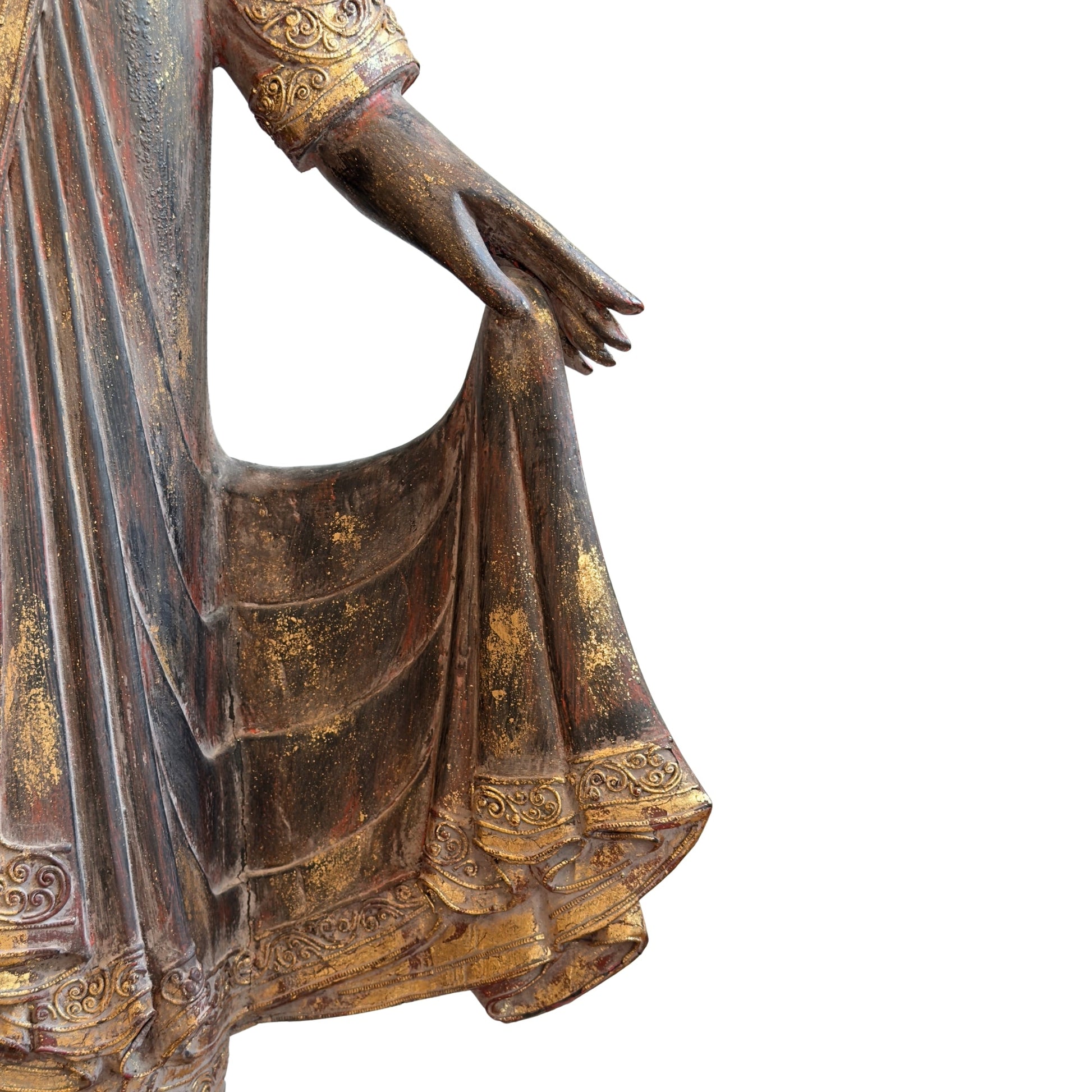 Surviving gold-leaf remnants on the antique Burmese standing Buddha