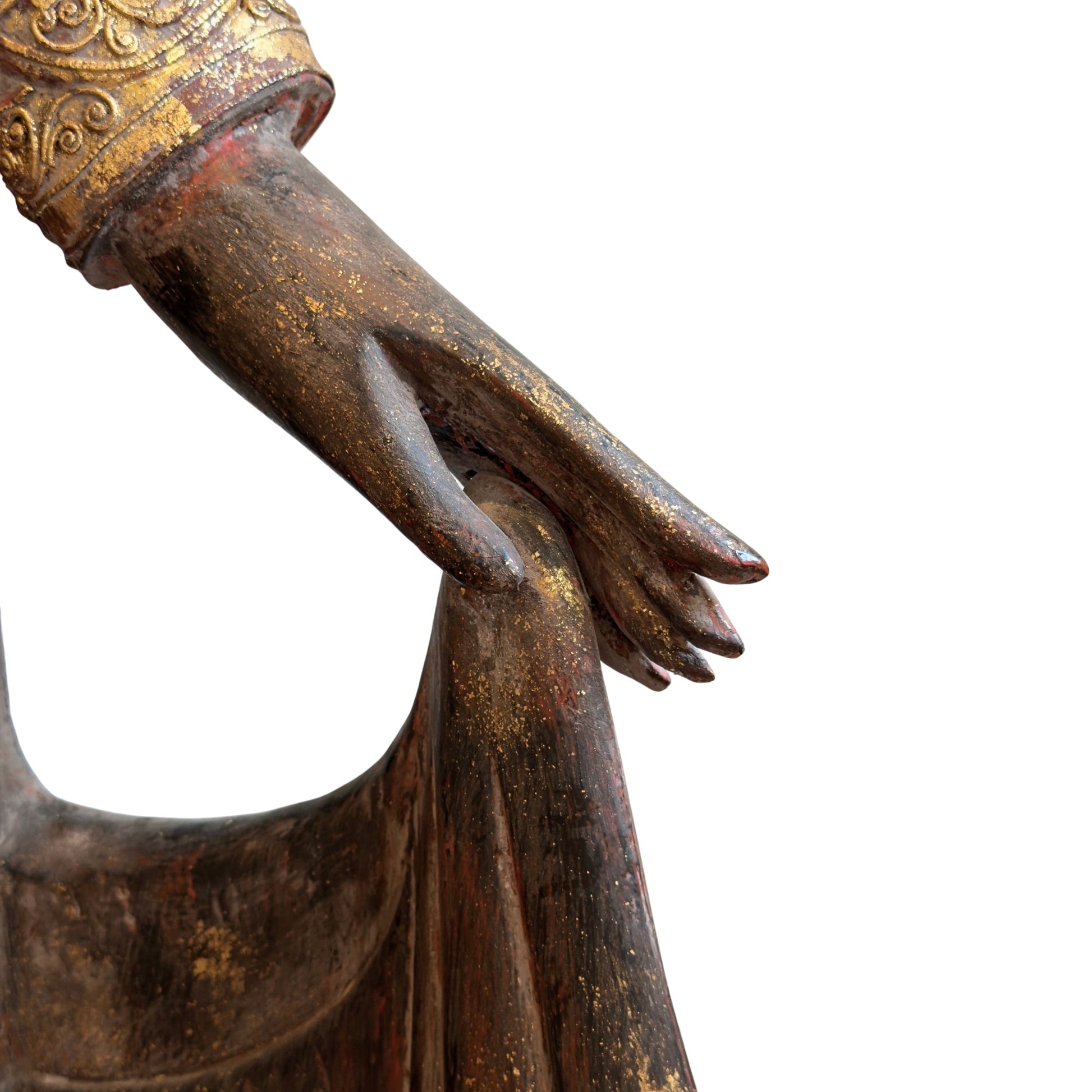 Hand detail of the monumental Burmese standing Buddha in carved teak