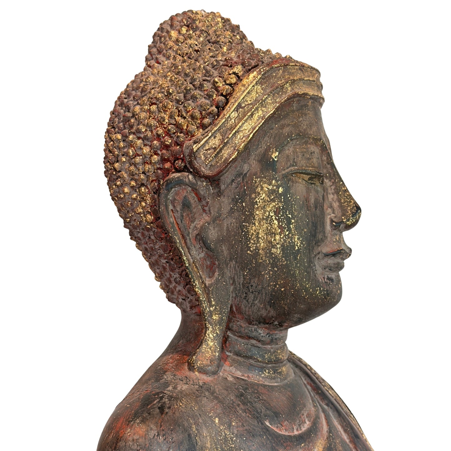 Side view of the head of the antique Burmese standing Buddha