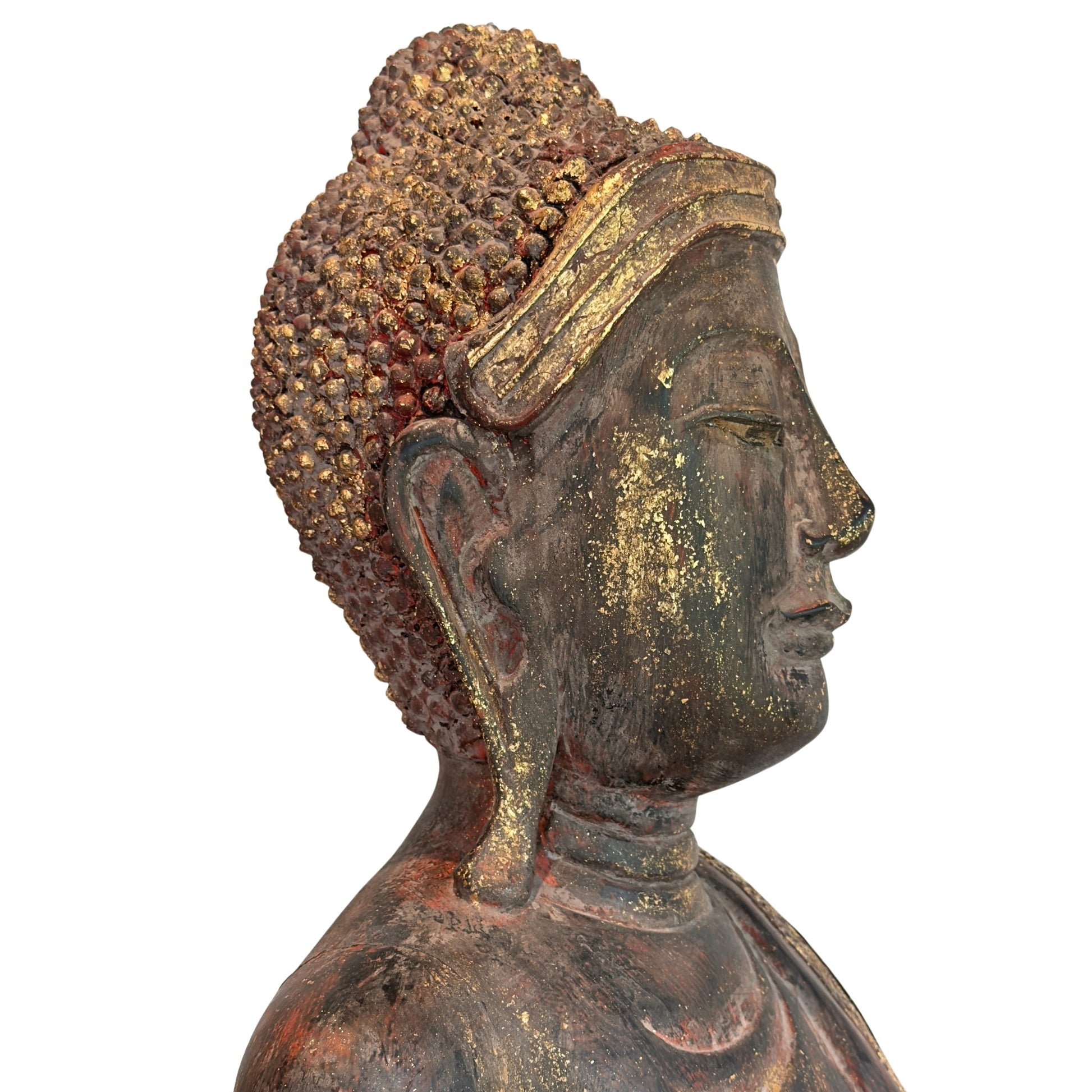 Side view of the head of the antique Burmese standing Buddha