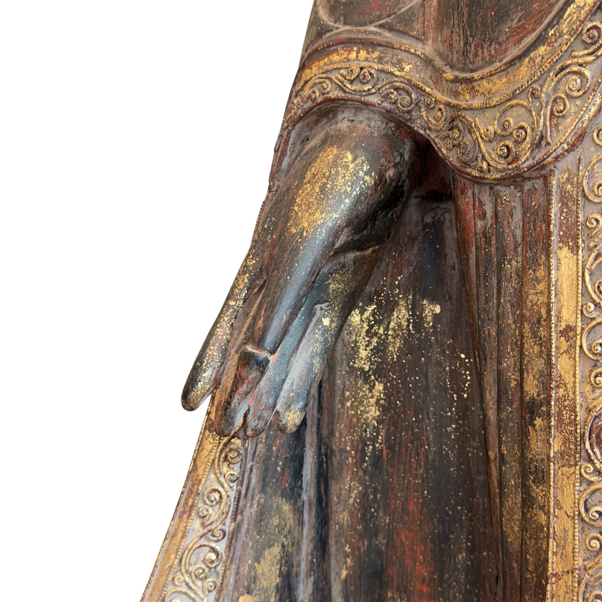 Historic lacquer layers on the carved teak Burmese standing Buddha