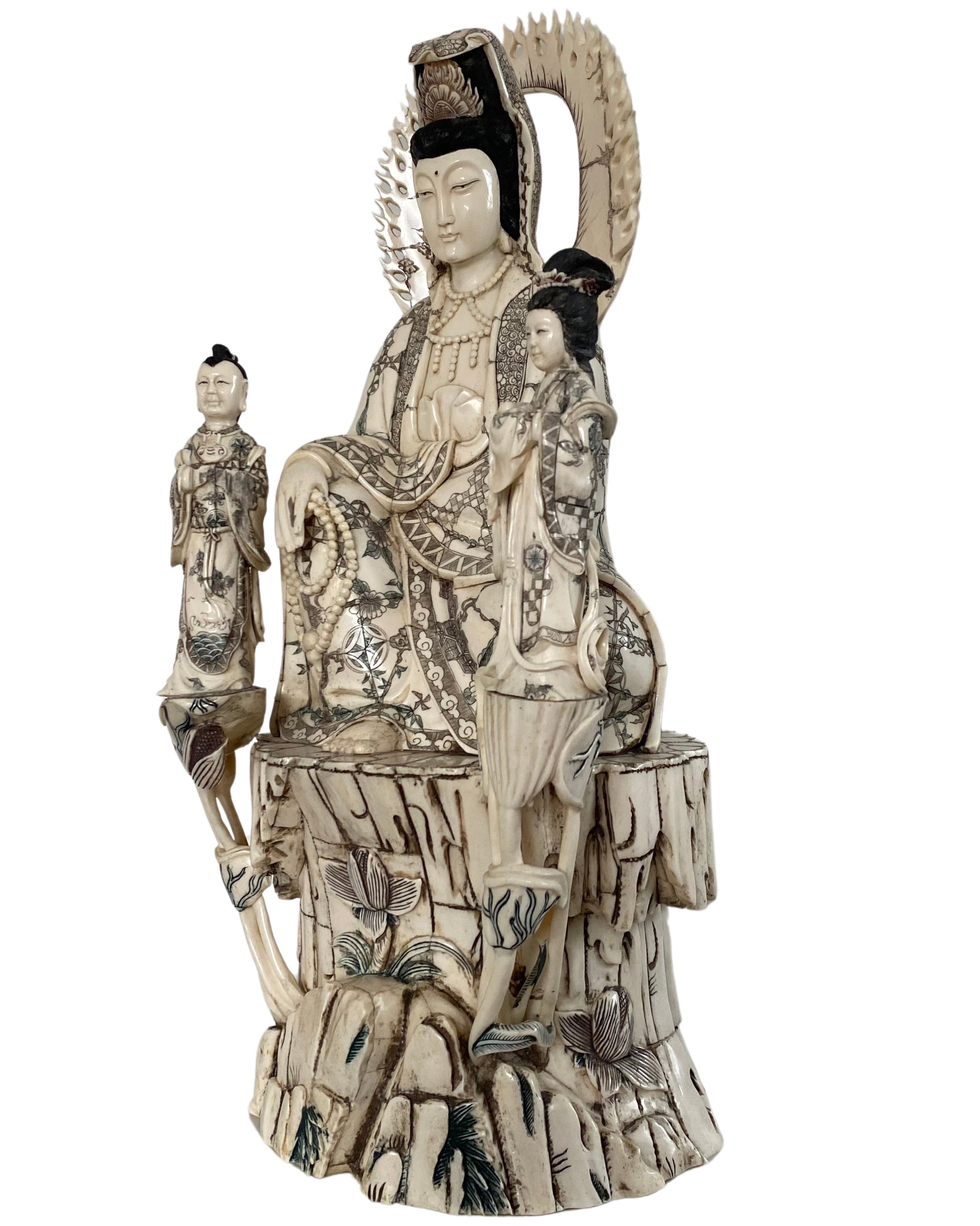 Chinese Guanyin seated among carved lotus motifs and ornamental details