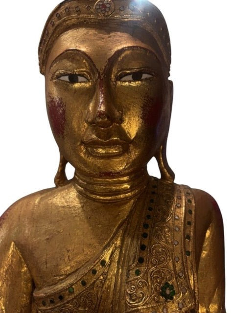 Red lacquer preparation visible beneath the worn gilding