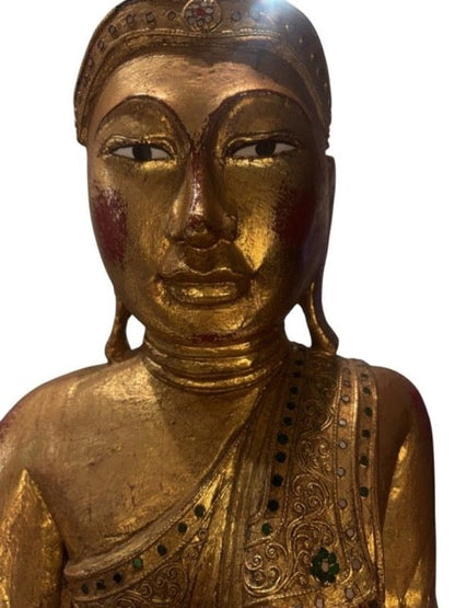 Red lacquer preparation visible beneath the worn gilding