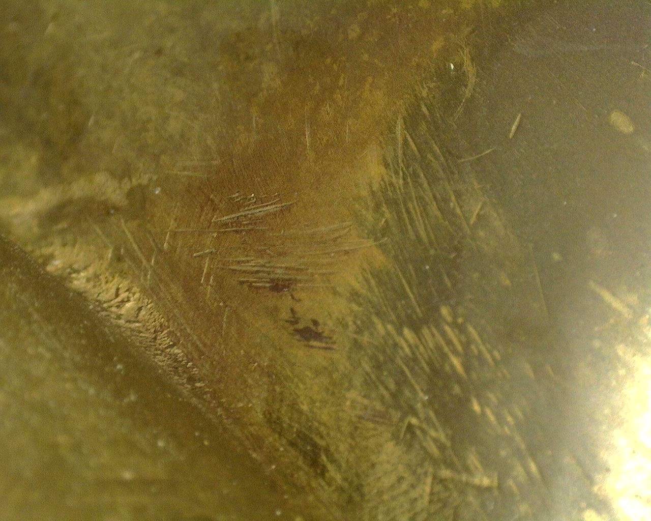 Detail van de kwikvergulding met karakteristieke vuurvergulde textuur en eeuwenoude patina.
