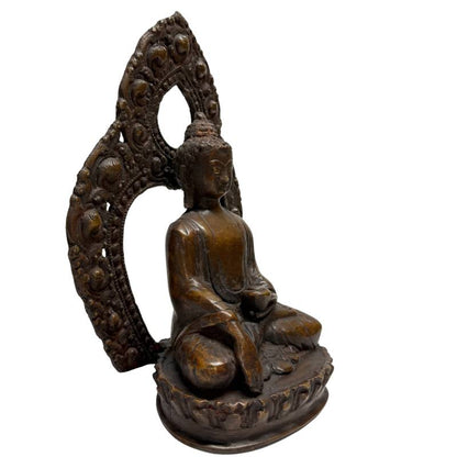 Himalayan bronze Buddha with earth-touching gesture and openwork aureole, left angle