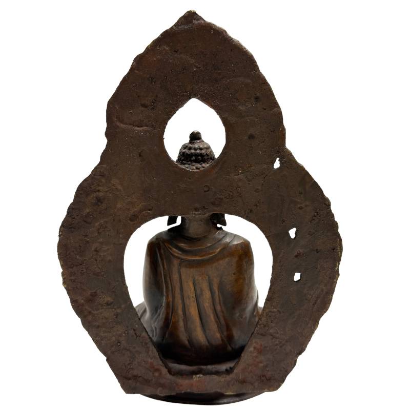 Rear view of Himalayan bronze Buddha with earth-touching gesture and aureole