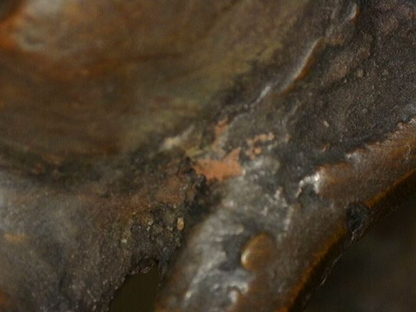 Close-up of surface wear and casting detail on Himalayan bronze Buddha