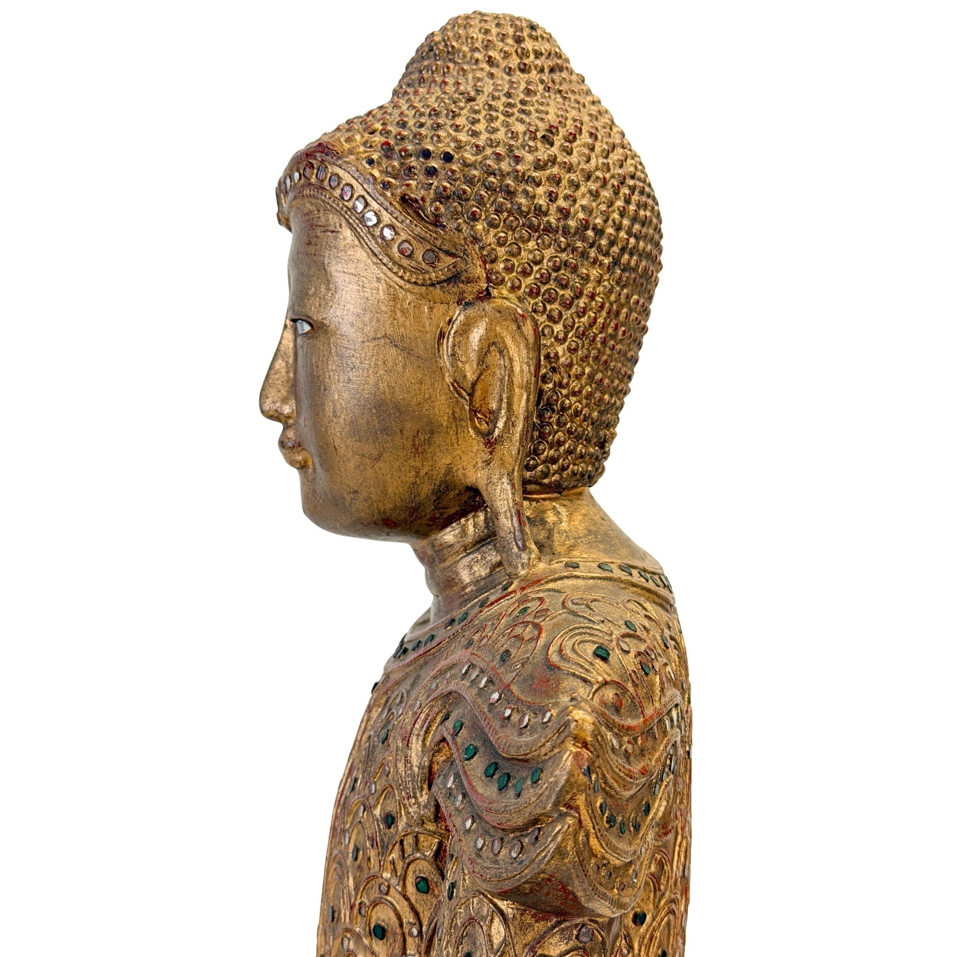 Left facial profile with inlaid eye and worn gilding on the Jambupati Buddha