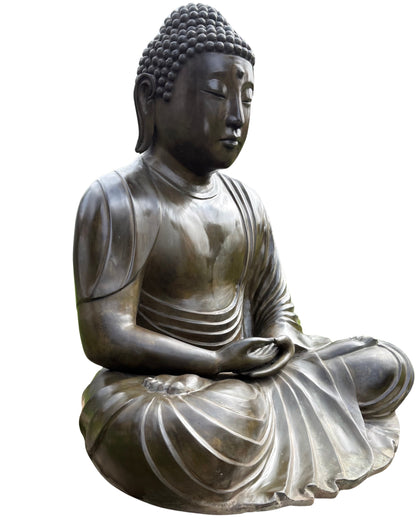 Face of the Japanese Amida Buddha with weathered bronze patina