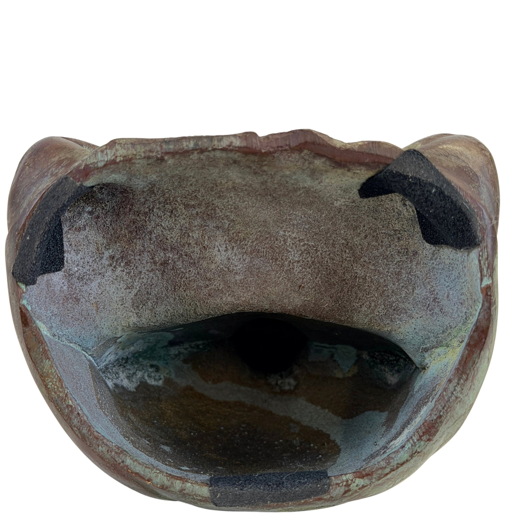 Underside of the Japanese bronze Buddha showing the open hollow-cast construction