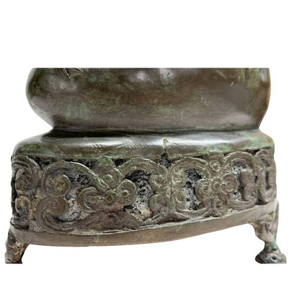 Left-side detail of the hand-finished openwork throne on the antique bronze Buddha