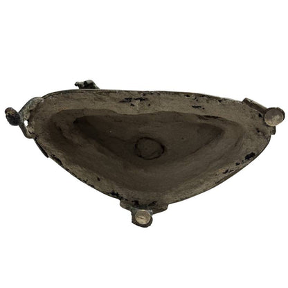 Underside of the antique Lan Na-style Buddha showing the hollow casting and retained core