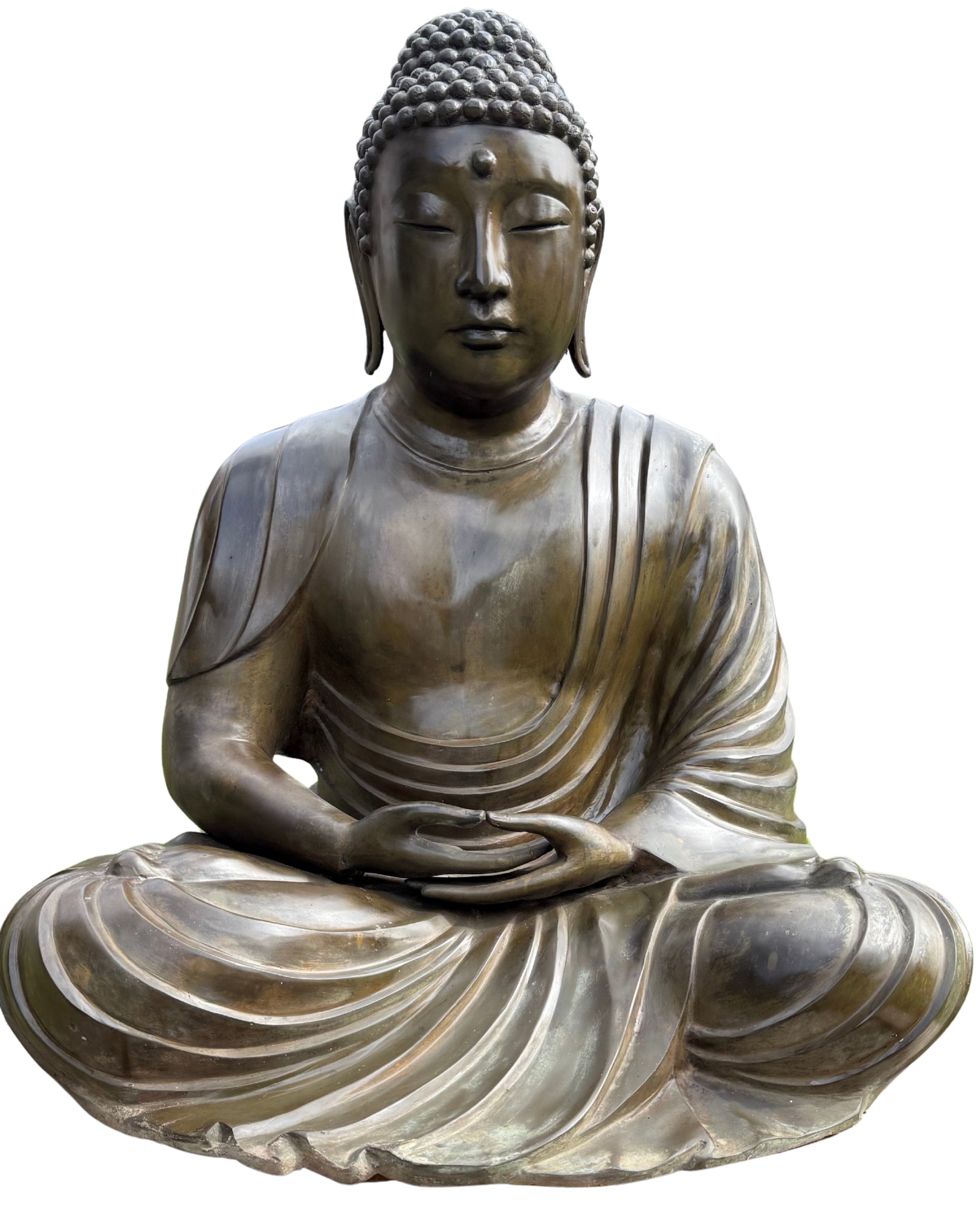 Large Japanese Amida Buddha in bronze displayed in a garden setting