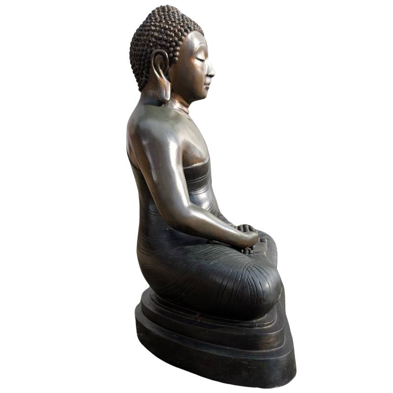 Naturally worn gilded surface of the Thai bronze Buddha