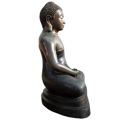 Naturally worn gilded surface of the Thai bronze Buddha