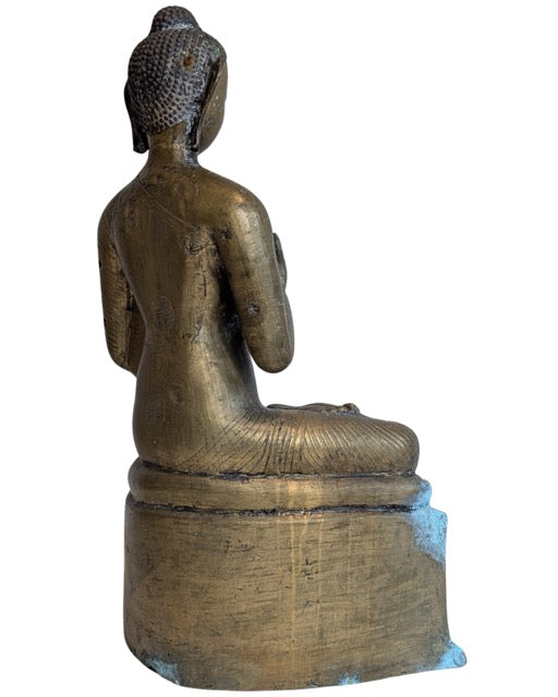 Natural blue-green patina on the bronze Buddha