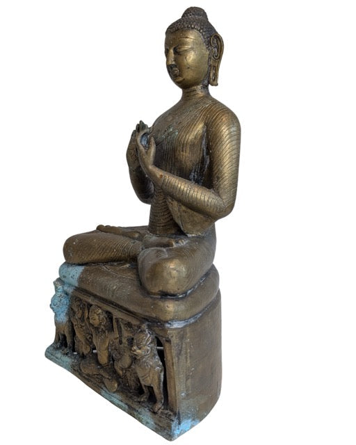 Detailed bronze robes on the seated Burmese Buddha