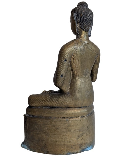 Dharmachakra teaching gesture held near the Buddha's chest