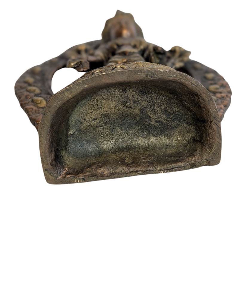 Subtle wear and aged surface on the bronze Tara