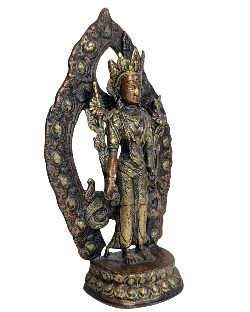 Natural aged patina on the standing Tara sculpture