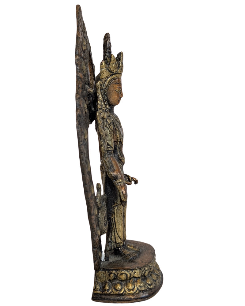 Ornate floral aureole surrounding the bronze Tara
