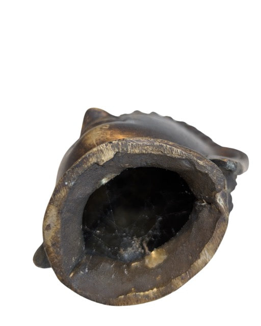 Dark natural patina on the bronze Buddha head